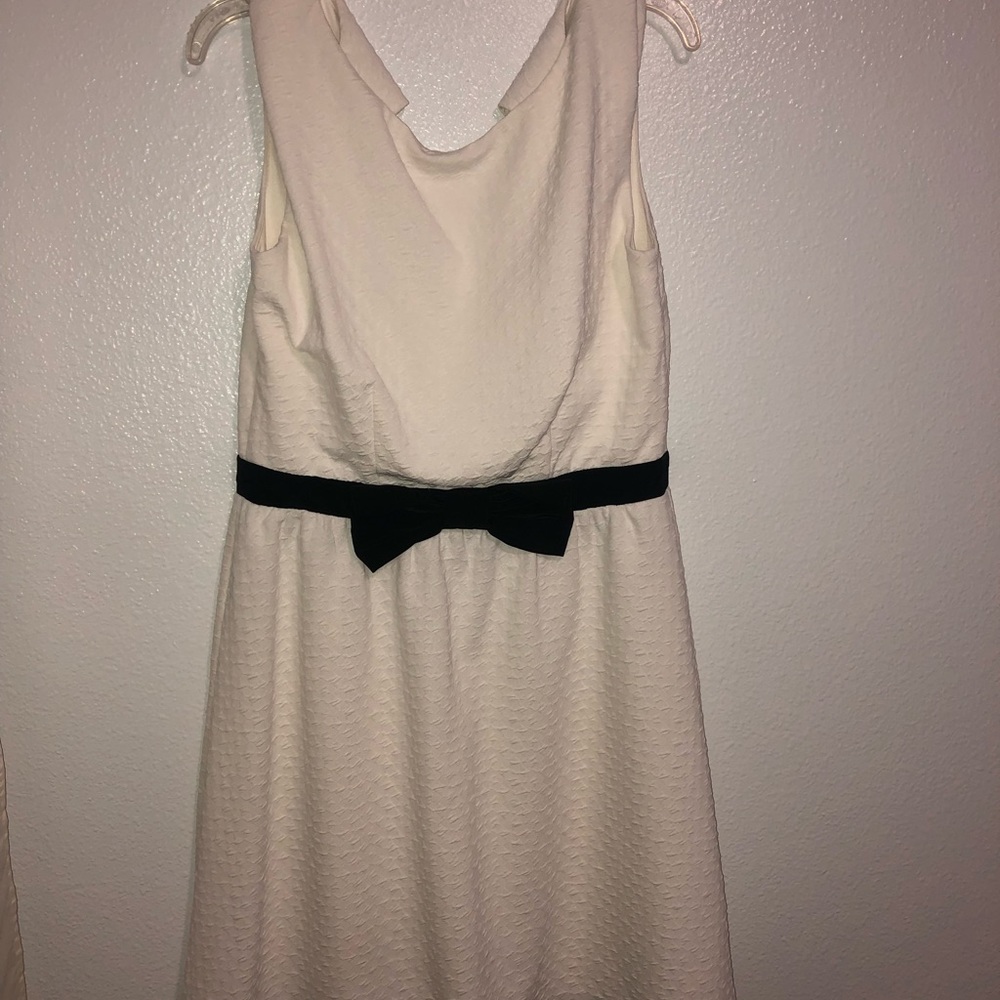 White and black formal dress with bow